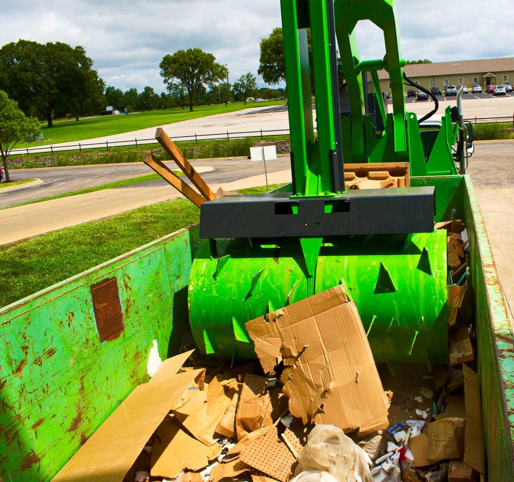 Crushr's Commercial Garbage Compactor Crushing Garbage in a Dumpster